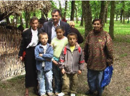 Mr. Vojislav Janošević, President of the Municipality of Surčin, and members of a disadvantaged family who received one-off assistance this year